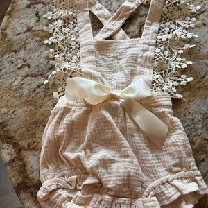 Reverie Threads cream color romper with adjustable criss cross lacy straps